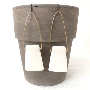 Long cream & gold colored earrings